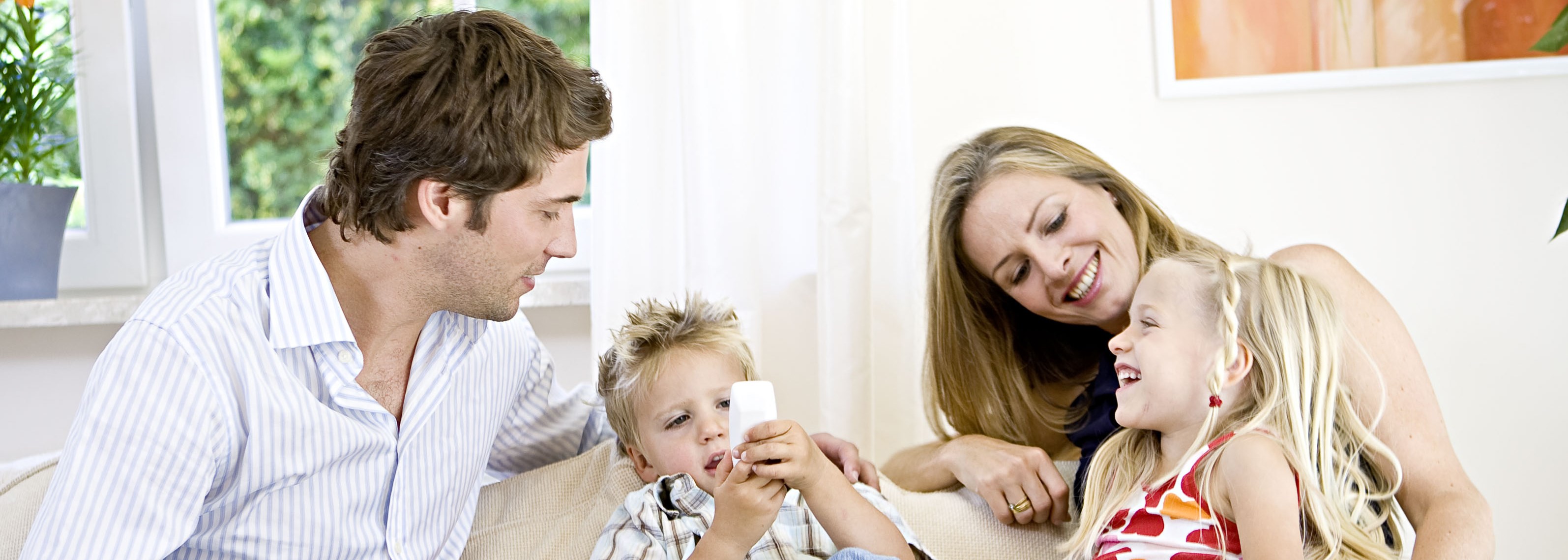 Family creating memories on couch.