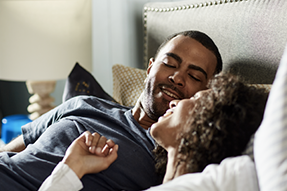 Man and woman laying next to each other