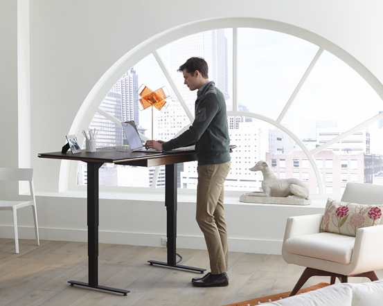 Man Standing at Desk